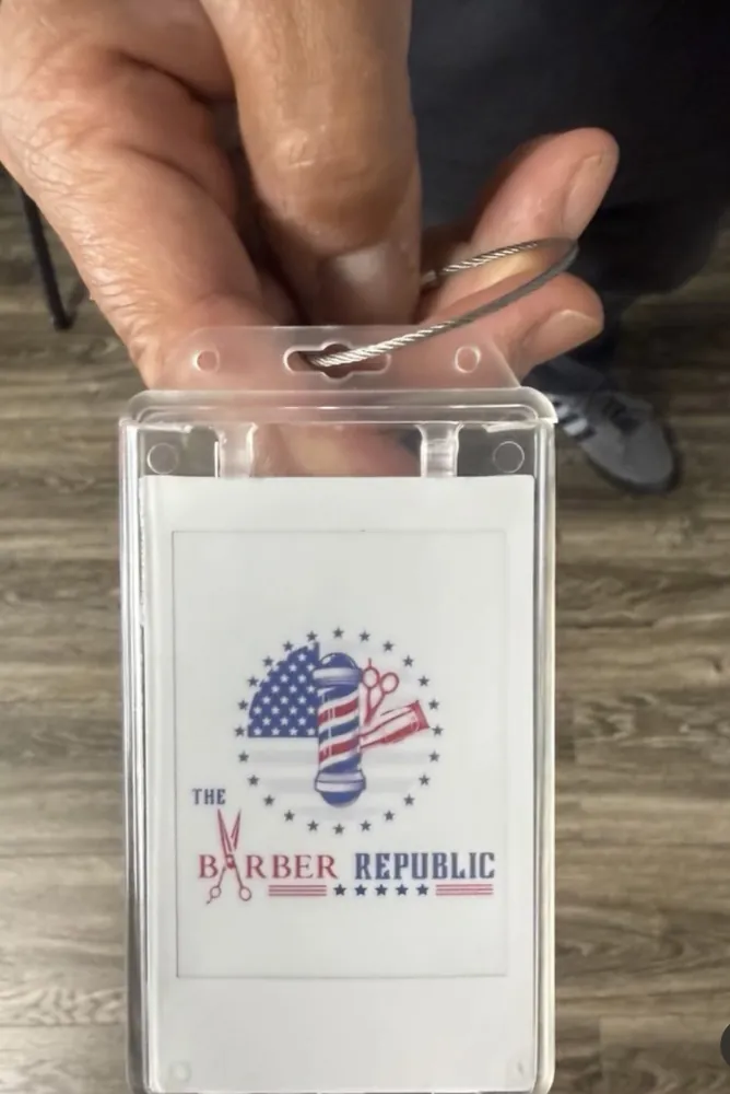 A custom Frame Wave tag featuring a barber shop logo