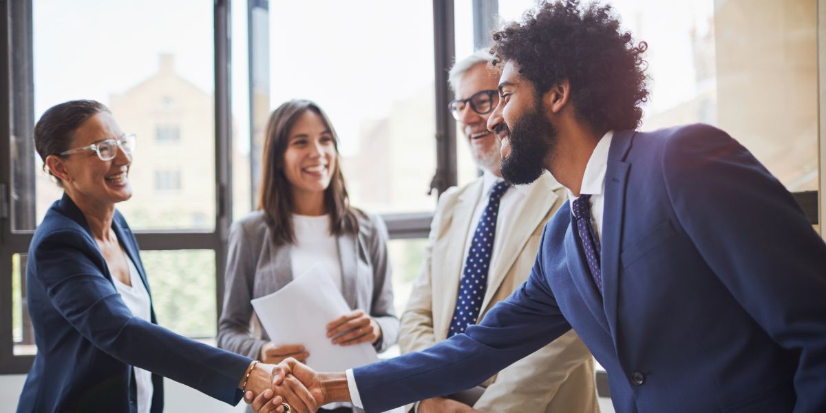 A lively professional networking event with people mingling and making connections.